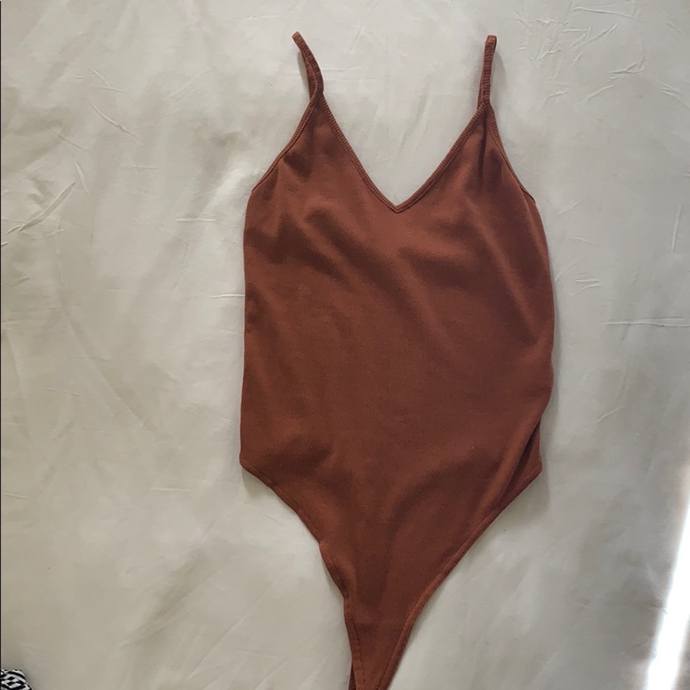 Burnt orange body suit